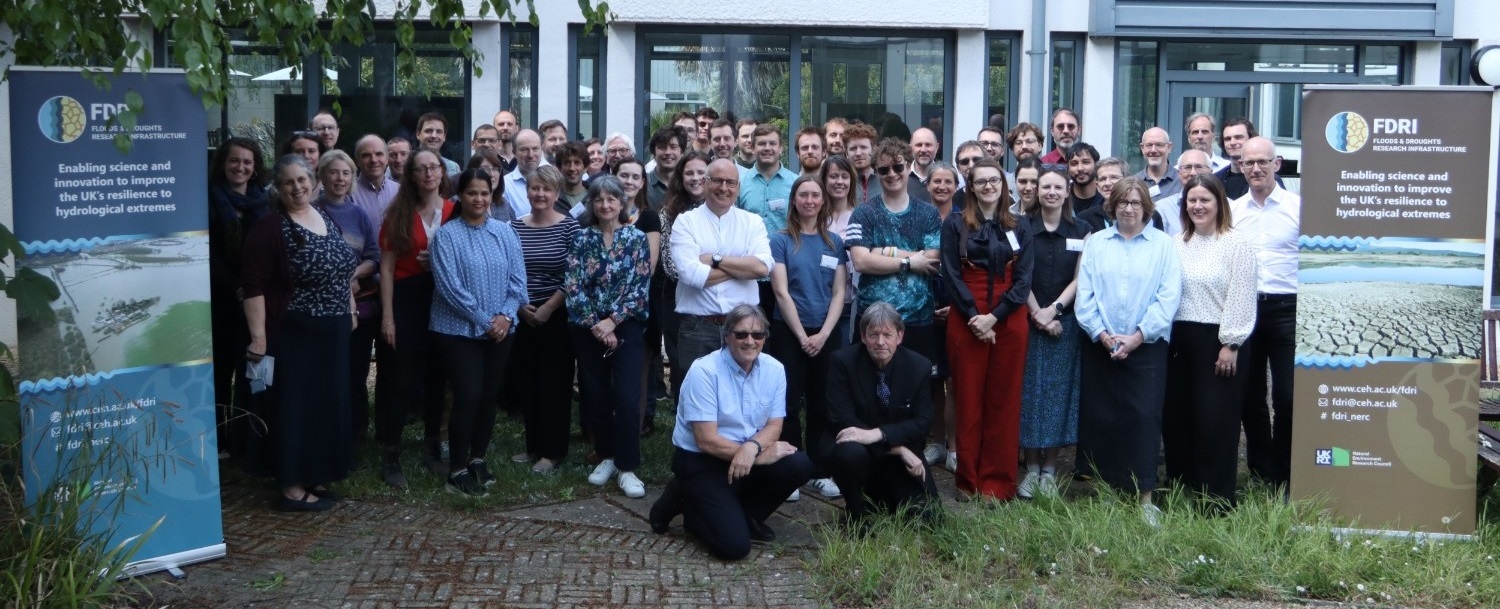 The members of the FDRI project team stand in front of a building
