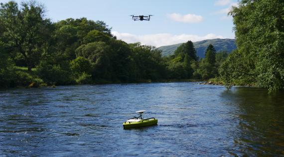 Arc boat on river and drone in the air