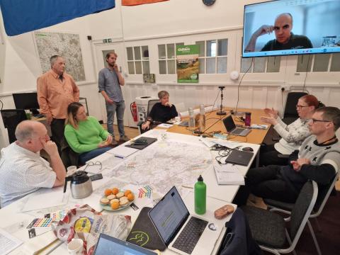 People around a desk at the Chess catchment workshop