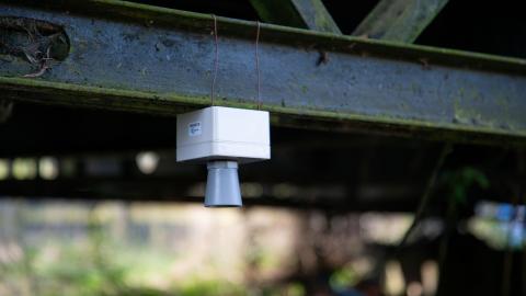 Open hardware device under a bridge