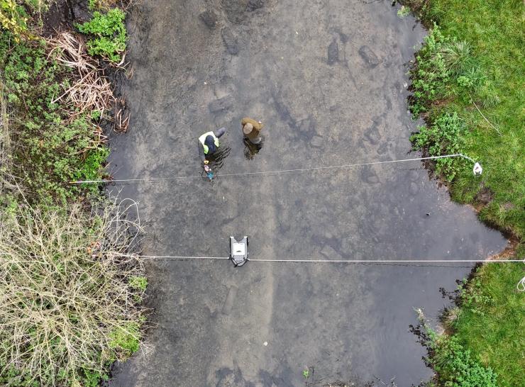 Field techs test an ADCP in the River Chess